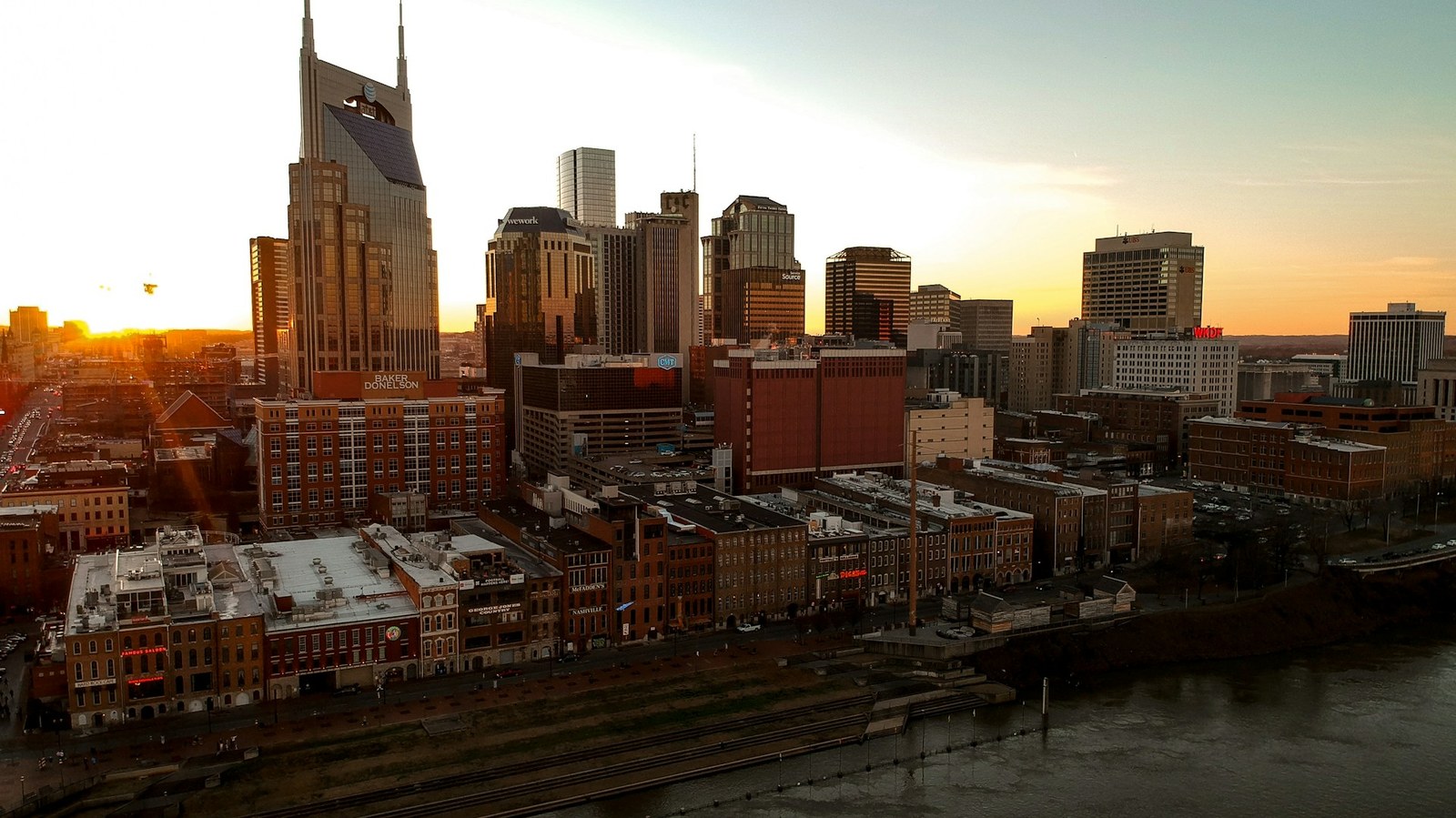 The downtown Nashville skyline along the Cumberland River at dusk
